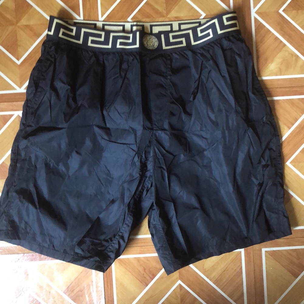 Versace swimwear only wore once.